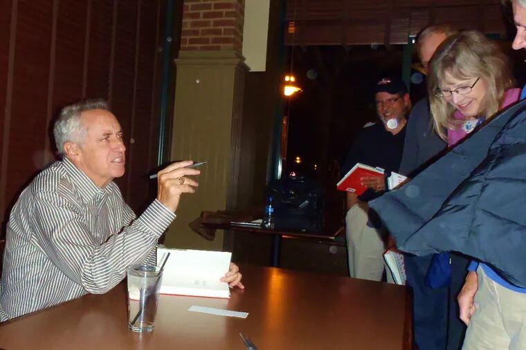 Rick Reilly makes a point at a book signing Thursday in Exton.