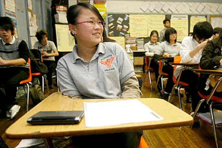 At Furness High, Ping Ting Wu attends an English-language class. The school has made progress in defusing racial unrest. Total violence was down 25 percent through December. (Charles Fox / Staff)