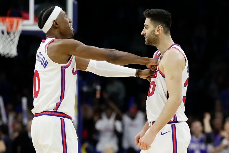 Sixers guard Furkan Korkmaz celebrates with teammate Josh Richardson after setting a career-high 34 points late in Friday's win over Memphis.