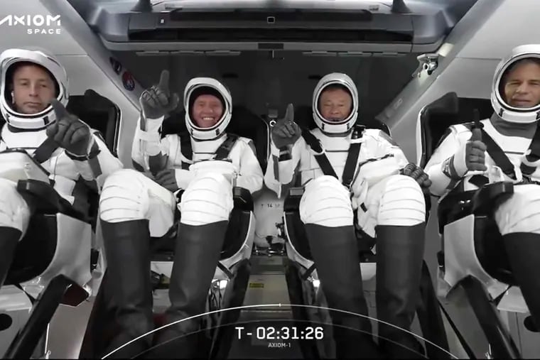 The SpaceX crew seated in the Dragon spacecraft on Friday.