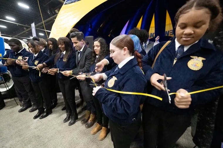 W.B. Saul students cut a ribbon during a ceremony for Nick’s Closet, an initiative recognizing Nicolas Elizalde, the Saul student who was fatally shot in September. The ceremony took place on Monday at the 2023 Pennsylvania Farm Show in Harrisburg.