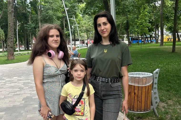 Valentina Yermachkova, 20, (right) rescued her sisters, Sofiia, 15, (left) and Anastasia, 9, from Russian-occupied territory in Ukraine. Their mother and brother were killed by Russian shelling in Mariupol.