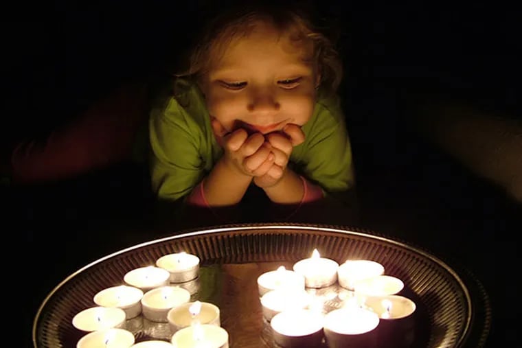 A child in the Czech Republic observed Earth Hour 2013, as did many others around  the world. In Philadelphia, not so much. (Photo copyright Ondrej Vavricek)