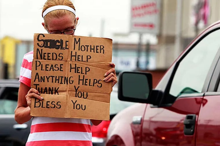 Samantha, 35 from South Philly is panhandling at Pier 70 Blvd & Columbus Blvd on South Philly.  July 12, 2013 ( AKIRA SUWA  /  Staff Photographer )