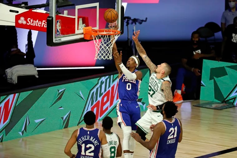 Philadelphia 76ers guard Josh Richardson (0) shoots around Boston Celtics center Daniel Theis (27) during the second half in Game 3 of their first-round playoff game at The Field House.