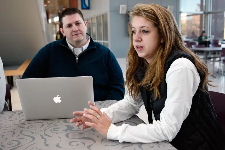 Kyle Bowen, Penn State's director of education technology services, and Lindsay Diamond, 19, a sophomore marketing major from Paramus, N.J. "I think the main problem with this book is that there is so much information on each concept, but the concepts aren't linked together," Diamond said of the book she created for class.