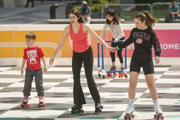 Roller-skating at Dilworth Park is one low-cost option for summer fun in Philadelphia.