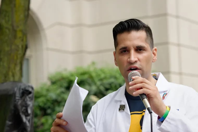 Nurse practitioner Tarik Khan, pictured advocating for Philadelphia patients in July 2019, writes that the federal government needs to step up its game in providing essential coronavirus supplies to healthcare workers.