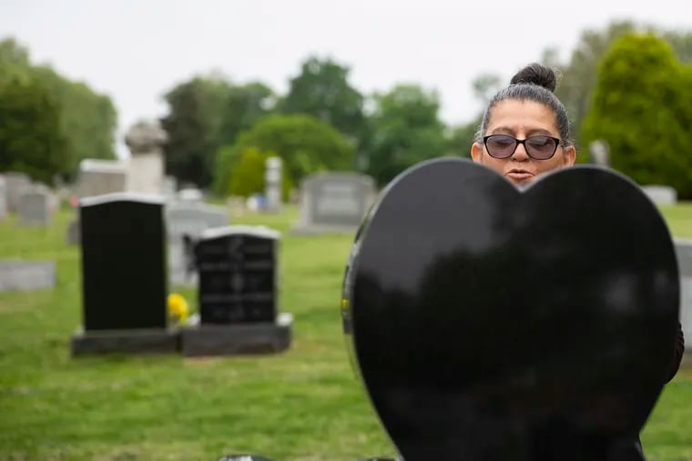 Elsa Alicea speaks to her youngest son, Luis Martin Alicea, at his grave inside Greenmount Cemetery in Philadelphia. Luis Martin Alicea was shot and killed in 2016. Elsa has coffee at his grave every morning to help her cope with his death.