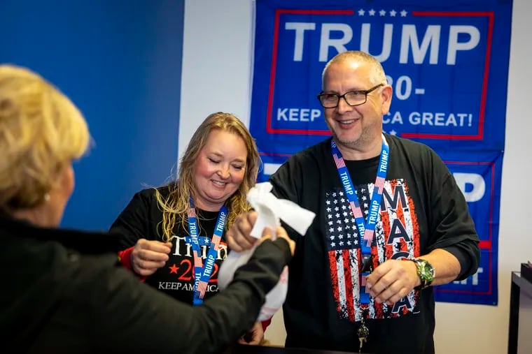 Michael Domanico (right), owner of Trump Store, and his wife, Monica Domanico, during their grand opening in Bensalem in February.