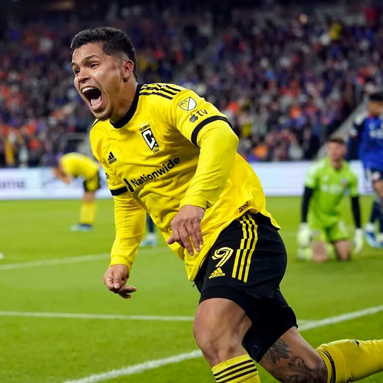 Columbus Crew forward Cucho Hernández celebrates after teammate Christian Ramirez's game-winning goal late in extra time.
