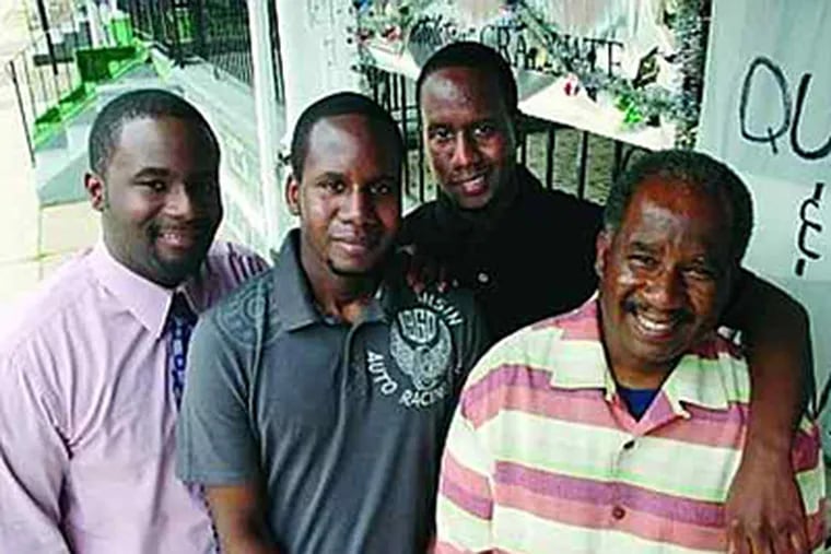 From left, Williams triplets Jason, Oliver and Quentin with their father, Keith Sr. (Sarah J. Glover / Staff)