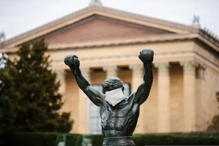 The Rocky statue is outfitted with a mock surgical face mask at the Philadelphia Art Museum on April 14, 2020.