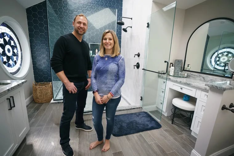 Aaron and Allison Greenfield of Plymouth Meeting have remodeled their bathroom to include a large shower with two heads, a niche vanity, and heated floors.