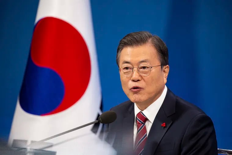 South Korean President Moon Jae-in speaks during an on-line New Year press conference with local and foreign journalists at the Presidential Blue House in Seoul, South Korea Monday, Jan. 18, 2021.