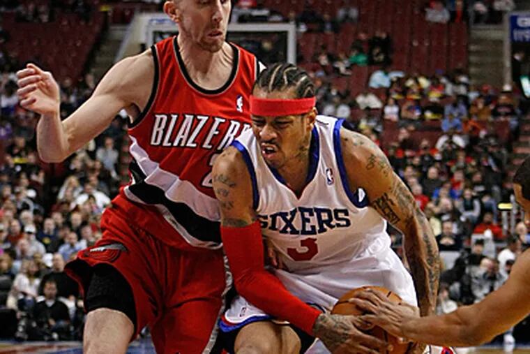Allen Iverson drives by Portland guard Steve Blake during the Sixers' 98-90 loss to the Blazers. ( Ron Cortes / Staff Photographer )