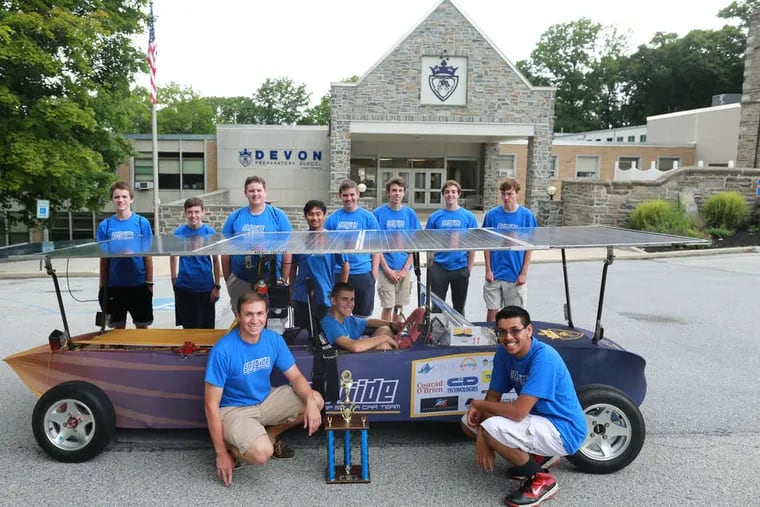 Devon Preparatory School's solar car team shows off its car, Sol Tide, and the trophy won at the 2014 Solar Car Challenge in Texas. The car reaches a speed of about 40 m.p.h. Front (from left), Mike Horbowy, Ben Conser, Soham Bharne; rear, Justin Hennessy, David Haruch, Evan Hennessy, Alex Carandang, Riley McCarthy, Albert Milani, Nick Ippoliti, and Russell Emery.