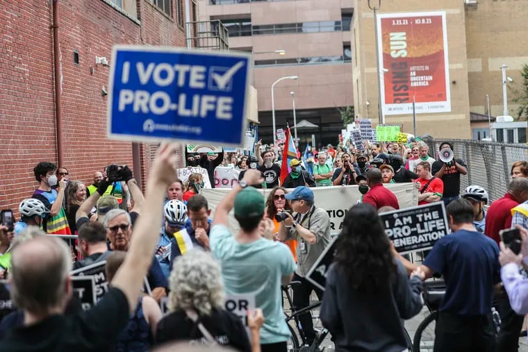 Participants in the Philadelphia March For Life are met by counterprotesters near Eighth and Appletree Streets, where the Philadelphia Women's Center is located. Anti-abortion activists observed the one-year anniversary of the U.S. Supreme Court's 'Dobbs' decision with a march and rally, which was met by abortion-rights protesters.