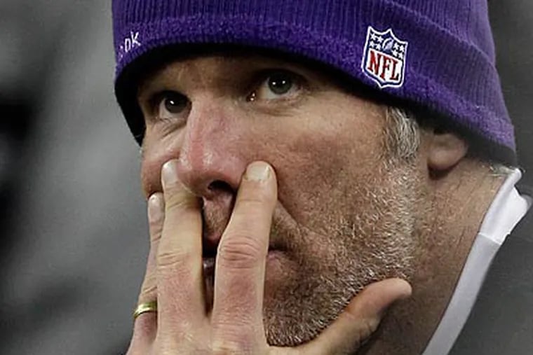 Brett Favre left the Vikings' game Monday after suffering a concussion. (Paul Sancya/AP)