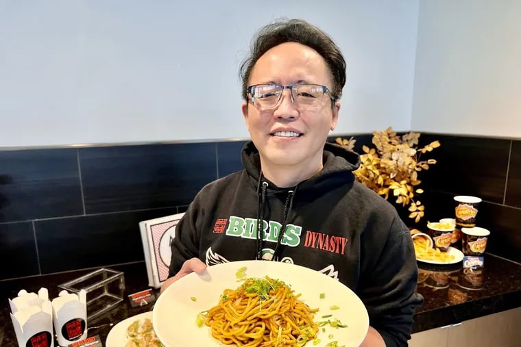 Han Dynasty chef/owner Han Chiang with vegetable lo mein at a Wells Fargo Center menu tasting.
