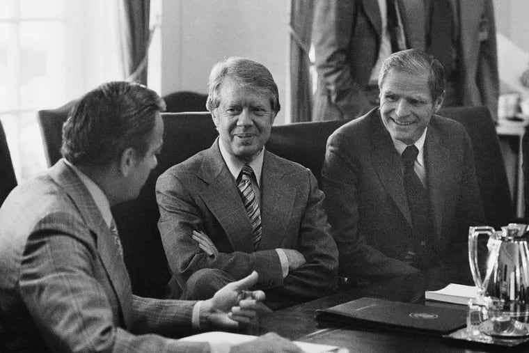 In this April 16, 1977, file photo, New Jersey Gov. Brendan Byrne, right, sits beside President Jimmy Carter, center, during a meeting at the White House in Washington, D.C. Byrne, a Democrat who served as New Jersey governor from 1974 to 1982, died Thursday, Jan. 4, 2018, at age 93. (AP Photo/Charles Bennett, File)