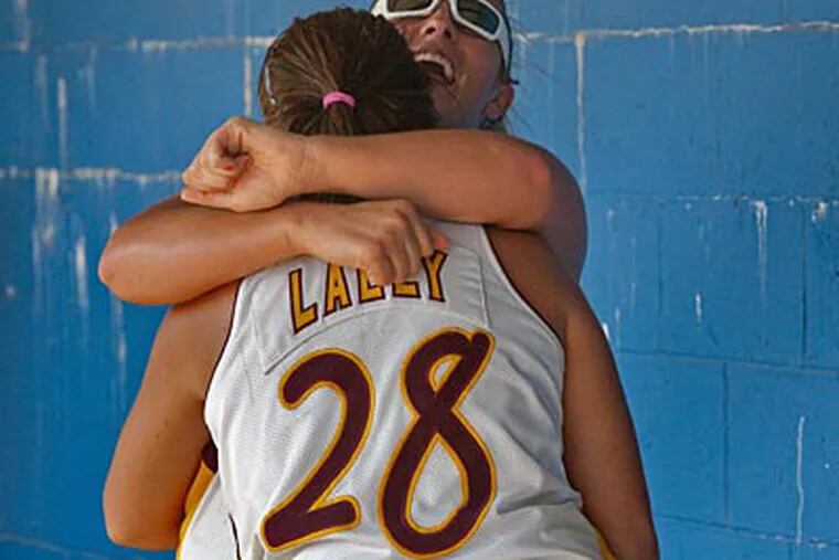 Gloucester Catholic first baseman Olivia Lawrence and right fielder MaryKate
Lally celebrate their team's 13 - 2 win against Sacred Heart for the South Jersey Non-Public B softball championship on June 1. (David M Warren / Staff Photographer)