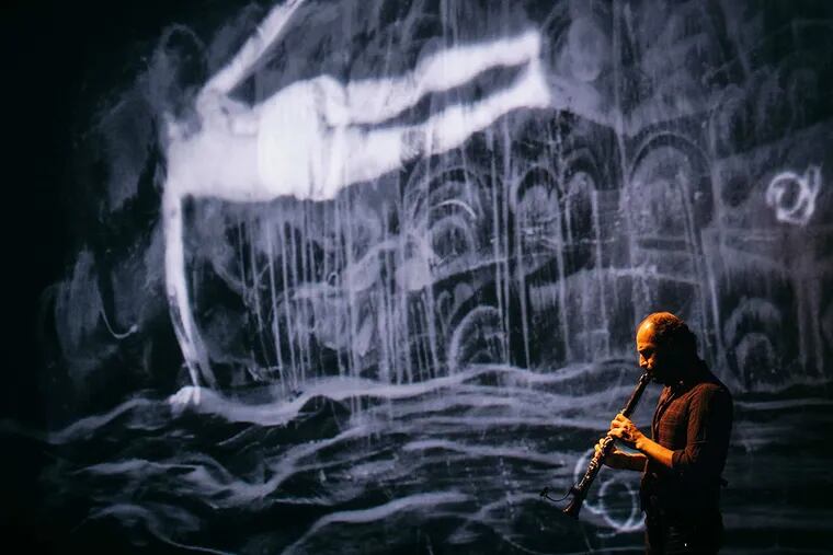 Kinan Azmeh (pictured) and Kevork Mourad (visuals) from Home Within, which they performed at International House.