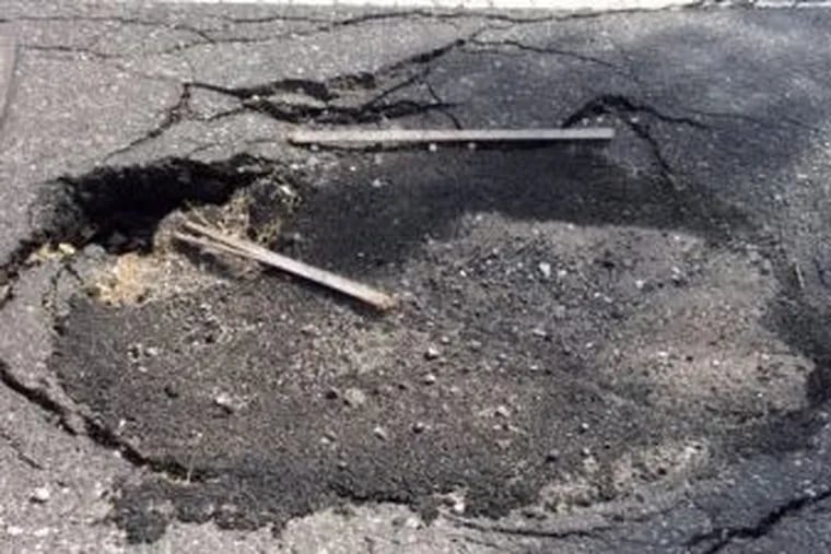 This sinkhole on Pattison Avenue near Citizens Bank Park caused Anthony Degliomini to crash his bike during charity bike ride May 17, 2015. A Philadelphia jury on Monday, March 5, 2018, awarded him $3.2 million in lawsuit against the city.