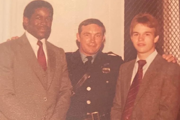 Officer Thomson (center) and other members celebrate the opening of a Police Athletic League center in 1981 at St. Michael’s Church in Kensington.