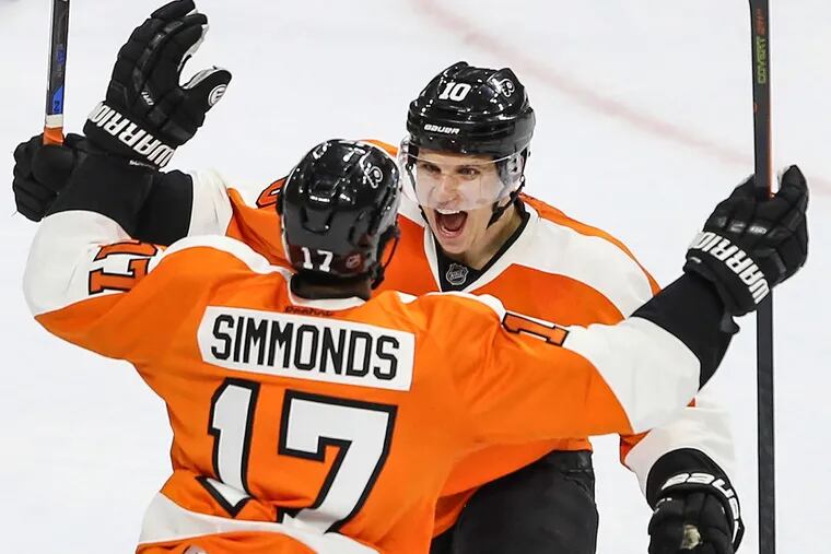 The Flyers' Brayden Schenn (10) celebrates his third-period goal with teammate Wayne Simmonds on Monday, March 7, 2016 during a victory over Tampa Bay.