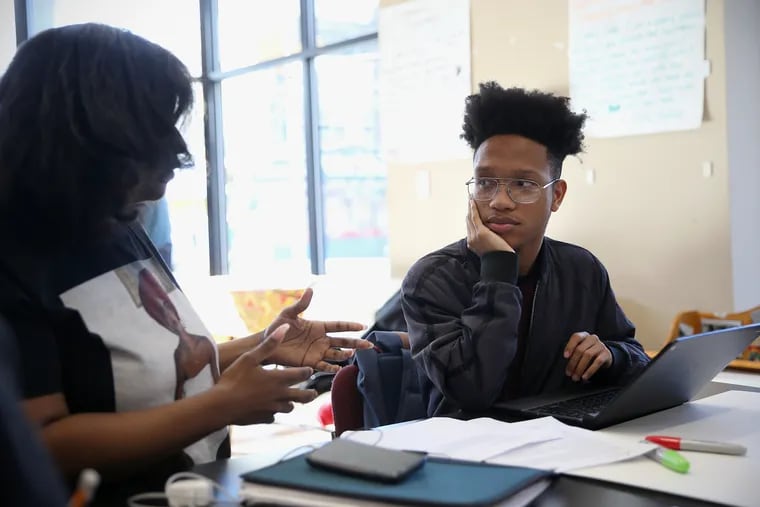 Science Leadership Academy at Beeber senior Amir Curry, right, works on a speech with help from organizer Saudia Durrant at the Philadelphia Student Union office in West Philadelphia on Tuesday, March 26, 2019. Curry argues that the school board's decision to mandate metal detectors disrespects student and school autonomy.