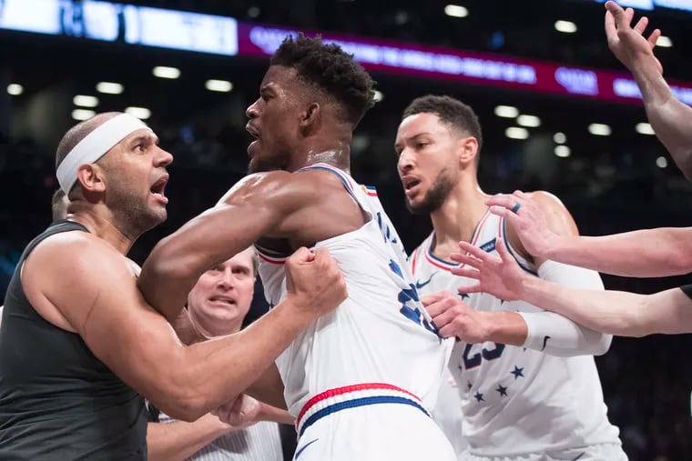 Brooklyn Nets forward Jared Dudley, left, gets into a shoving match with Philadelphia 76ers guard Jimmy Butler (23) during the second half of Game 4 of a first-round NBA basketball playoff series, Saturday, April 20, 2019, in New York. The 76ers won 112-108. (AP Photo/Mary Altaffer)