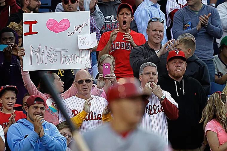 Fans cheer on the Angels' Mike Trout. (Laurence Kesterson/AP)