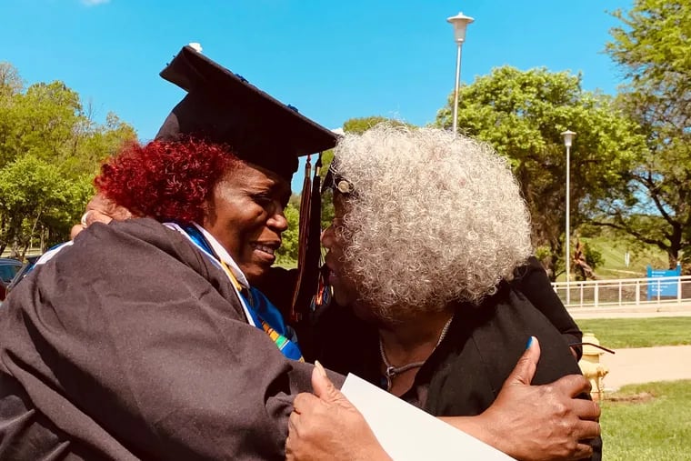Rhonda Davis, a grandmother from North Philadelphia, was all smiles with her aunt Brenda Reed Saturday upon graduating from Cheyney University, where she was also valedictorian.