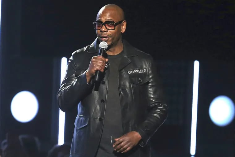 Dave Chappelle speaks at the 60th annual Grammy Awards at Madison Square Garden on Sunday, Jan. 28, 2018, in New York. Chappelle will host a Roots Jam session at this year’s Roots Picnic at the Festival Pier at Penn’s Landing in June.