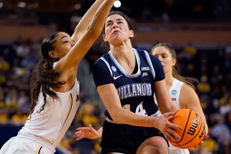 Villanova forward Brianna Herlihy (14) attempts a layup as Michigan guard Laila Phelia defends during the second half of a college basketball game in the second round of the NCAA tournament, Monday, March 21, 2022, in Ann Arbor, Mich. (AP Photo/Carlos Osorio)