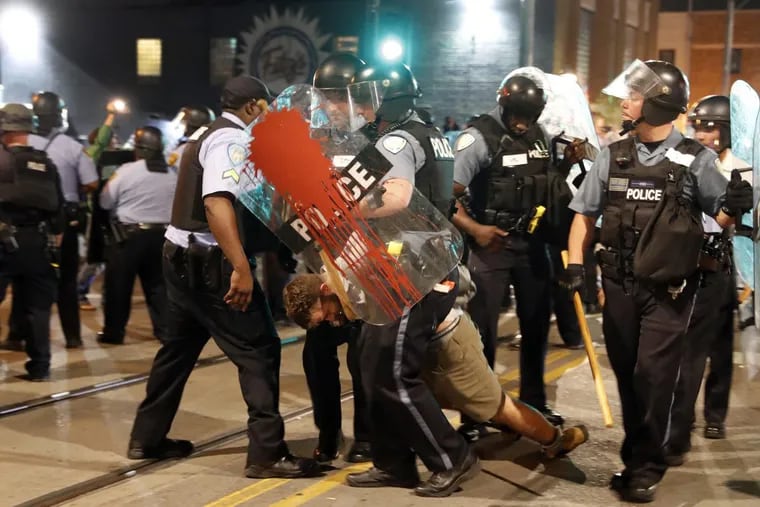 Police arrest a man during protests on Sept. 16  in University City, Mo., over a not guilty verdict in the trial of former St. Louis police officer Jason Stockley.