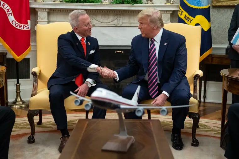 President Donald Trump meets with New Jersey Rep. Jeff Van Drew in the Oval Office of the White House on Dec. 19, 2019, to announce that Van Drew is switching parties to become a Republican.