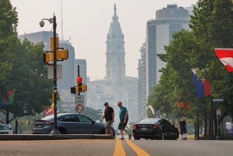 Philadelphia City Hall covered in a haze because of Canadian wildfire smoke in the sky.