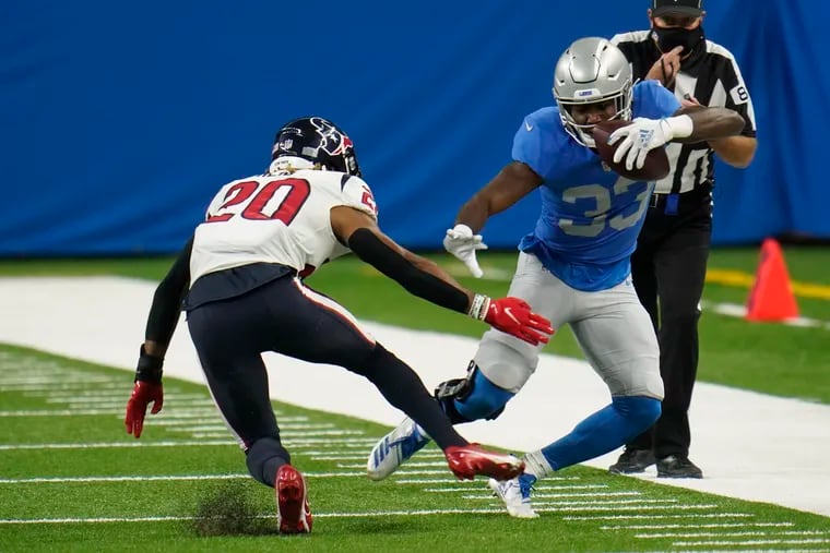 Running back Kerryon Johnson (right), then with the Lions, takes on Texans strong safety Justin Reid in November. Johnson is a solid blocker on passing plays.