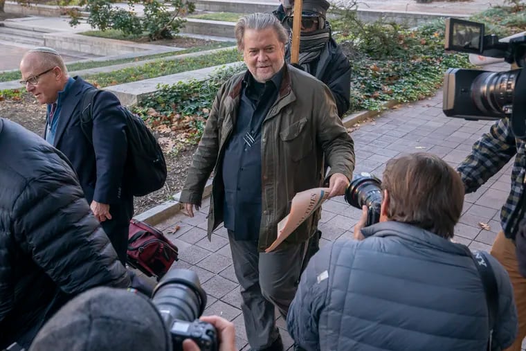 Steve Bannon, center, a longtime ally of former President Donald Trump, convicted of contempt of Congress, arrives at federal court for a sentencing hearing, Friday, Oct. 21, 2022, in Washington.