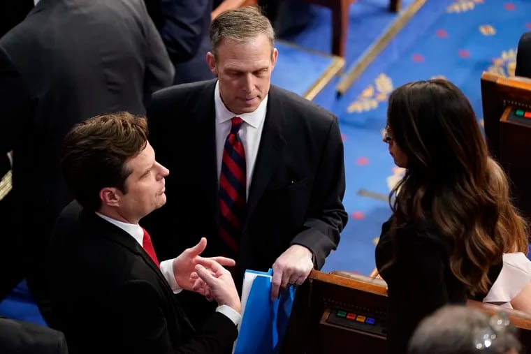 Rep. Scott Perry (R., Pa.) (center) speaks with Rep. Matt Gaetz (R., Fla.) and Rep. Lauren Boebert (R., Colo.) after the first round of voting for House speaker on Tuesday.