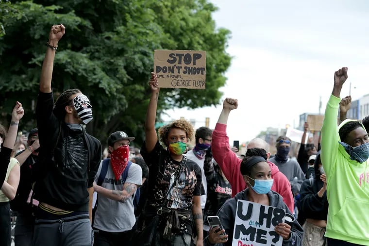 A group marches west on Girard Avenue during a peaceful protest in Fishtown neighborhood of Philadelphia, Pa. on June 2, 2020.