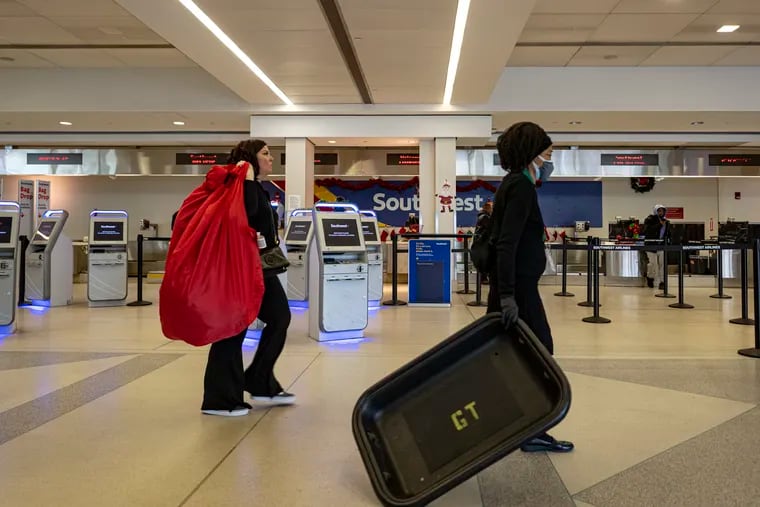 Southwest ticketing office is shown on Tuesday at Philadelphia International Airport. Southwest Airlines continues canceling flights as New Year holiday approaches.