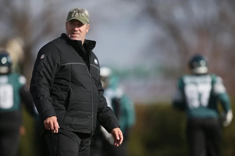 Eagles head coach Doug Pederson watches his players warm up during practice at the NovaCare Complex in South Philadelphia on Thursday, Nov. 29, 2018. TIM TAI / Staff Photographer