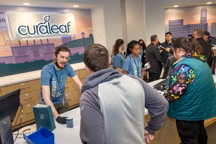 Customers buying recreational cannabis at Curaleaf during the opening day for recreational cannabis sales in New Jersey in April 2022.
