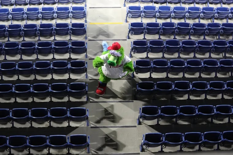 The Phillie Phanatic walks through an empty Citizens Bank Park during last weekend's season-opening series.