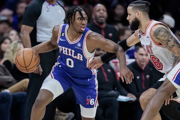 The Sixers' Tyrese Maxey drives on the Heat’s Caleb Martin during a game at the Wells Fargo Center in Philadelphia, Monday, February 27, 2023.