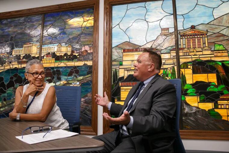 New Philadelphia school board members Leticia Egea-Hinton, left, and Christopher McGinley in a new conference room in the board offices.