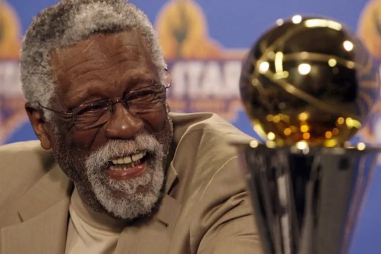Former NBA great Bill Russell, seen here with the NBA Finals Most Valuable Player trophy named for him.